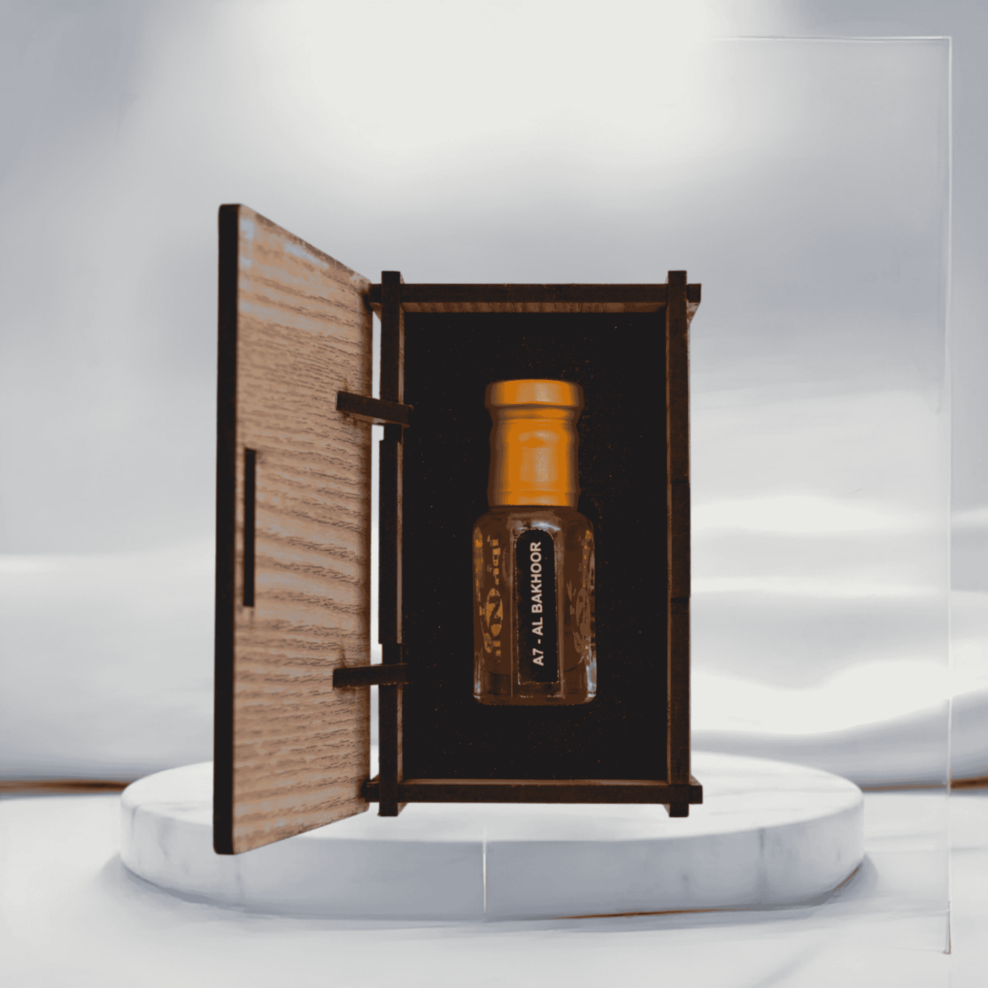 Elegant bottle of Bhakoor Attar with intricate design details.

