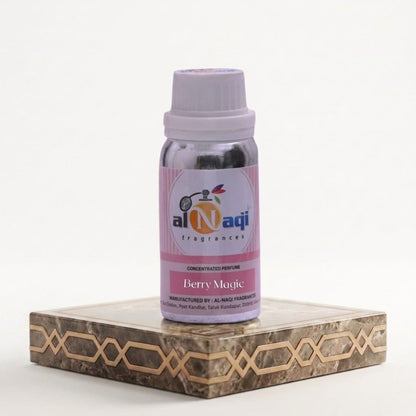 Bottle of Al-Naqi Berry Magic perfume on a decorative stand with a white background