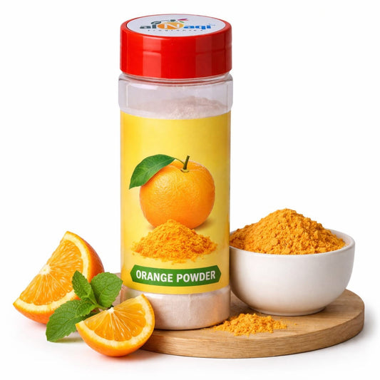Bottle of orange powder with oranges and a bowl of powder on a white background
