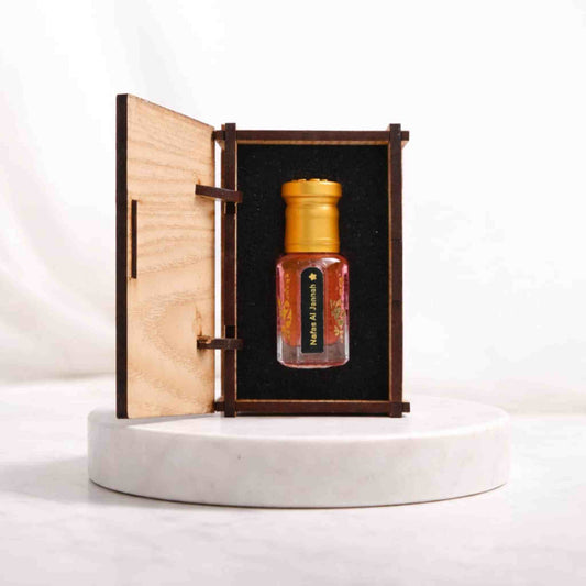 Small bottle with a wooden cap in an open wooden box on a white background