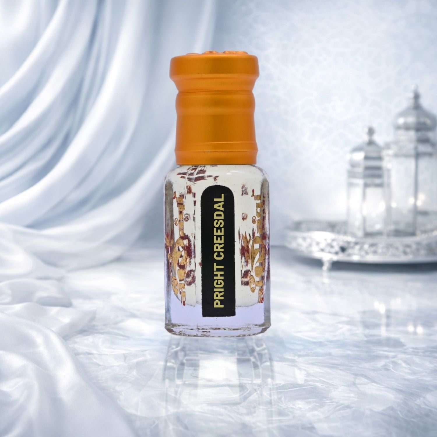 Attar packaging with intricate design placed on a dark background