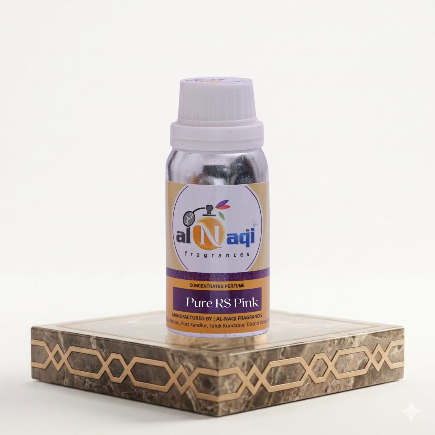 Bottle of Al-Naqi fragrances on a decorative stand with a white background