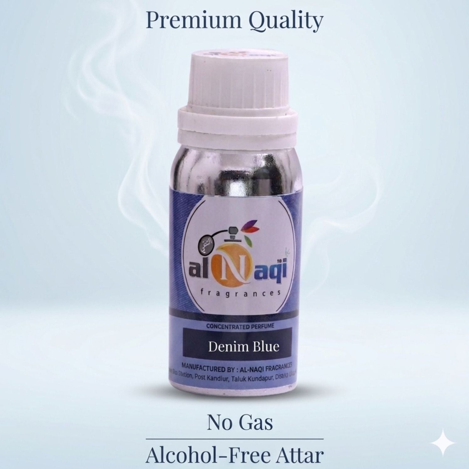 Bottle of Al-Naqi Denim Blue attar on a light blue background