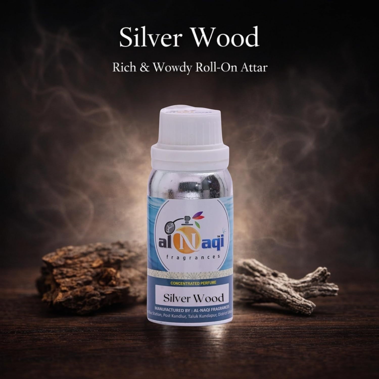 Bottle of Silver Wood roll-on attar with Al-Naqi branding on a dark background