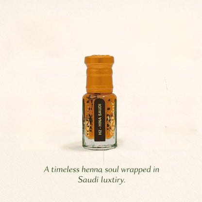 Small glass bottle with an orange cap on a beige background, featuring text about henna and Saudi luxury.
