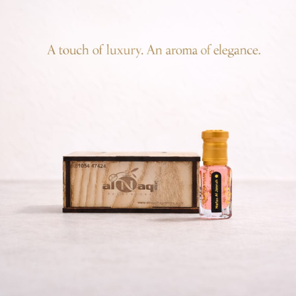 Perfume bottle with wooden box on a white background, featuring 'al-Naqi' brand.