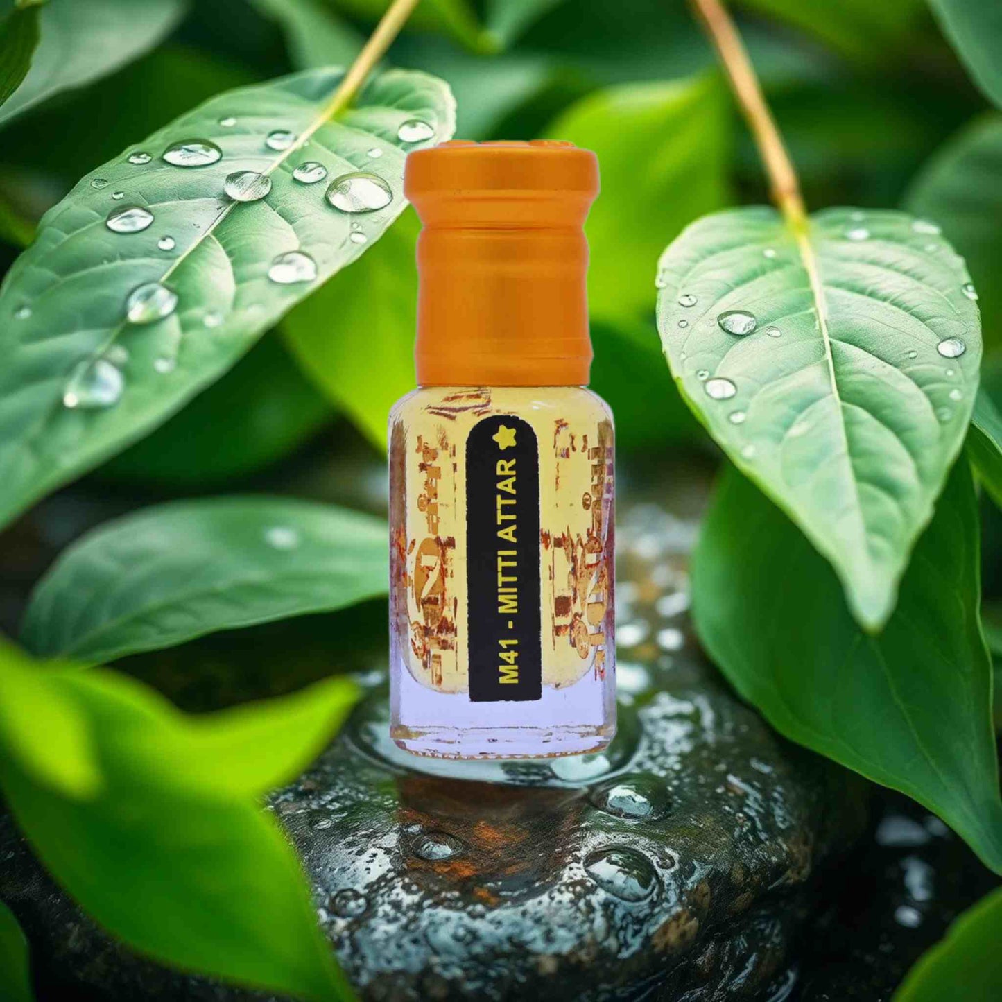 Small bottle with an orange cap on a stone surface surrounded by green leaves with water droplets.