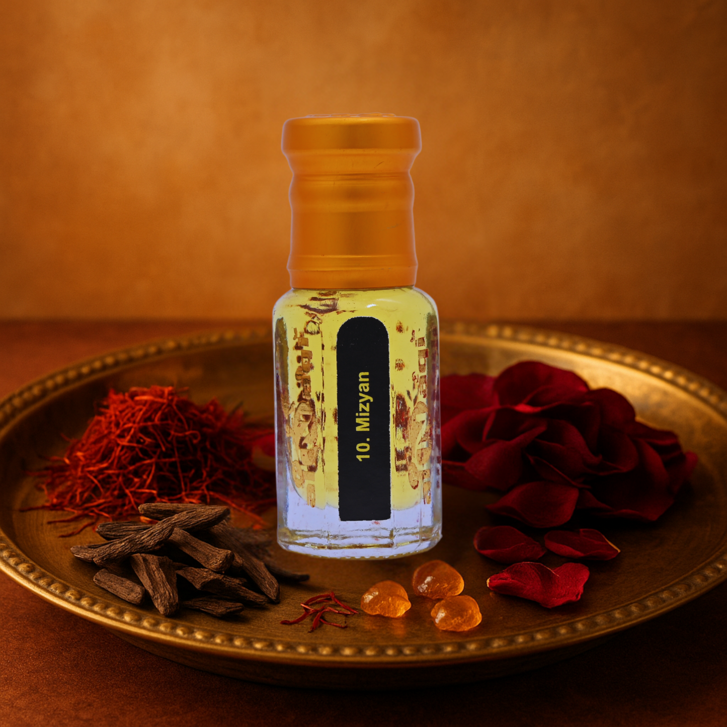 Small bottle labelled '10. Mizyan' on a decorative tray with saffron and rose petals.