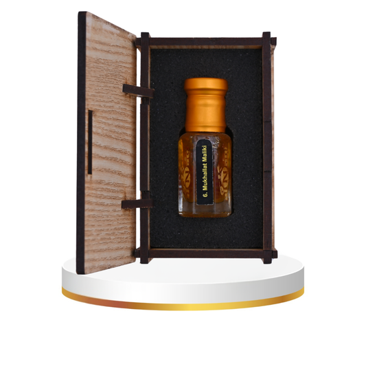 Close-up of Mukhallat Maliki attar showcasing its rich golden hue
