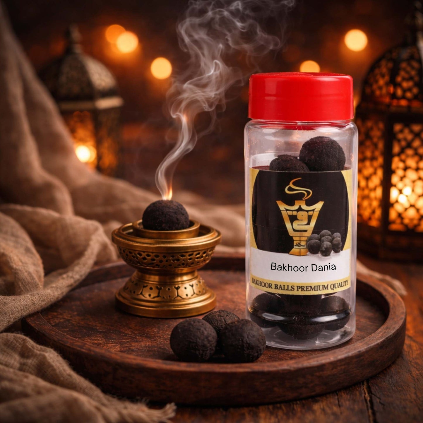 Bakhoor Dania incense balls with a smoking incense holder on a wooden tray.