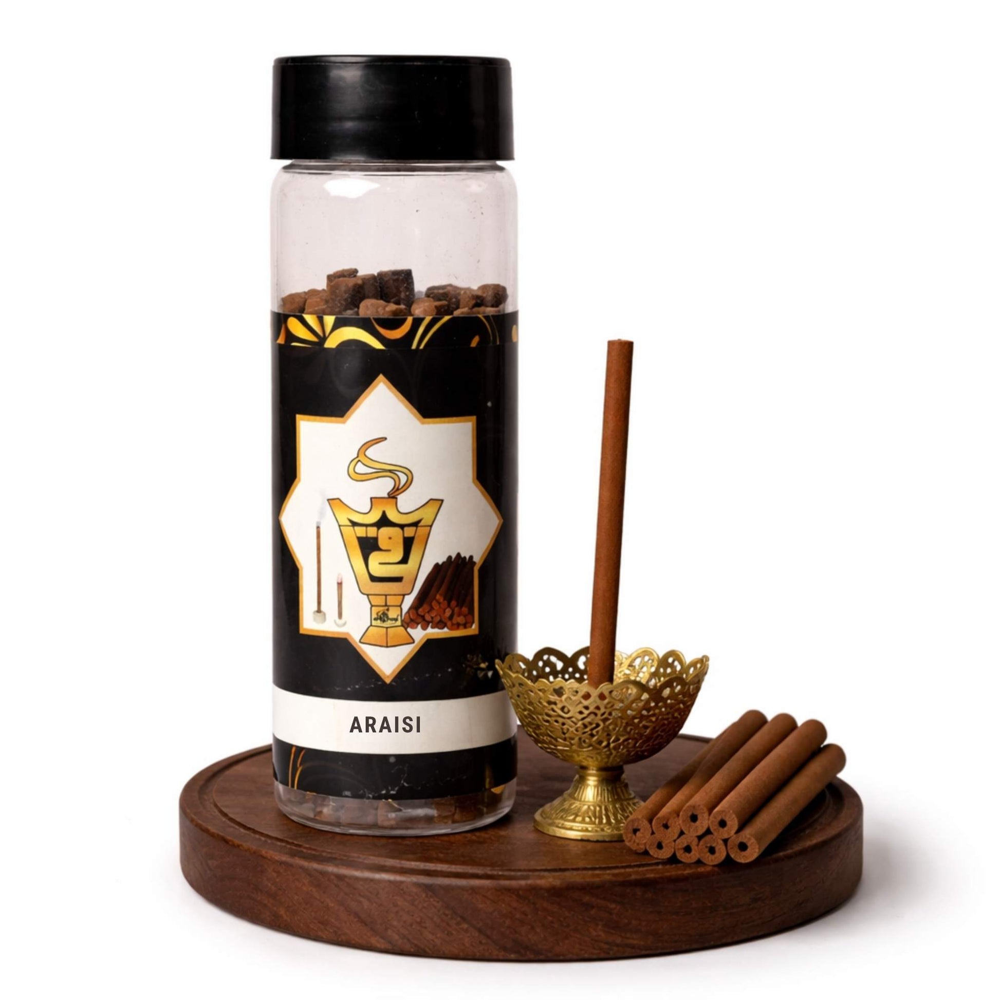 Araisi spice container with cinnamon sticks on a wooden tray