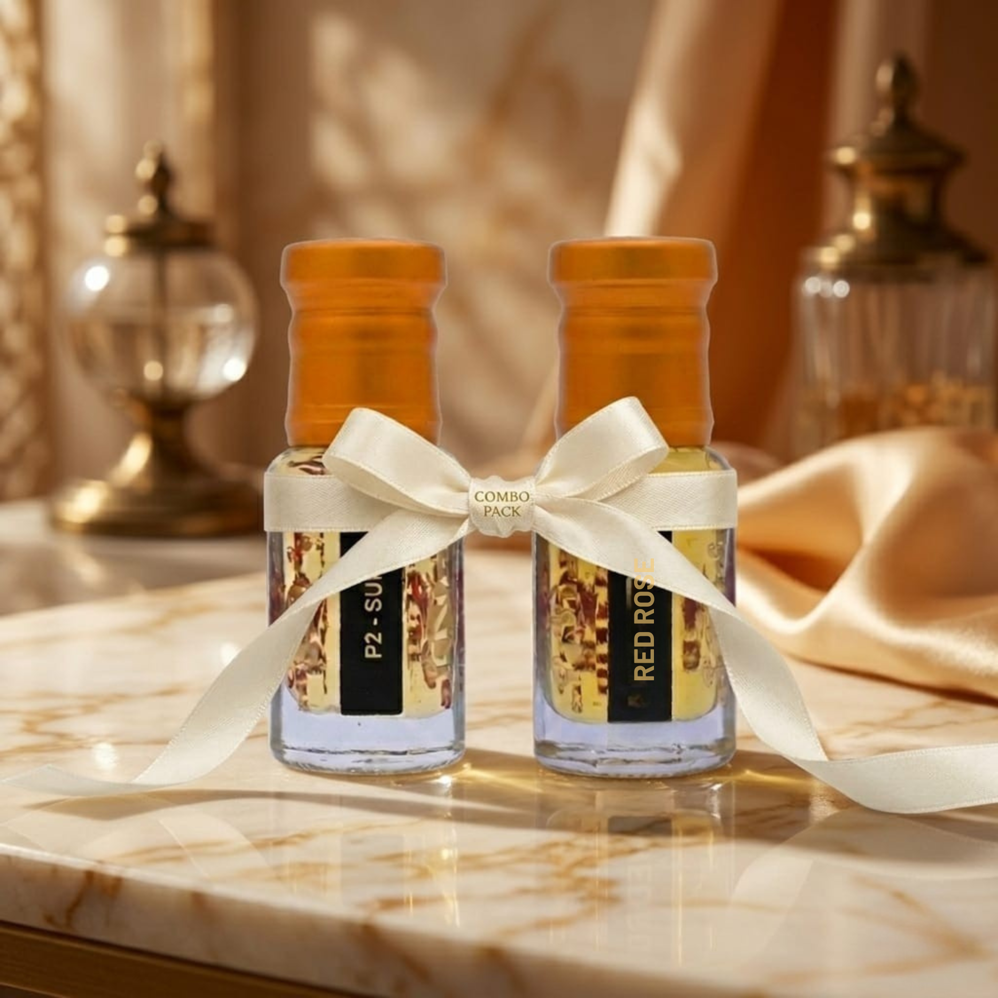 Two small bottles with decorative ribbons on a marble surface