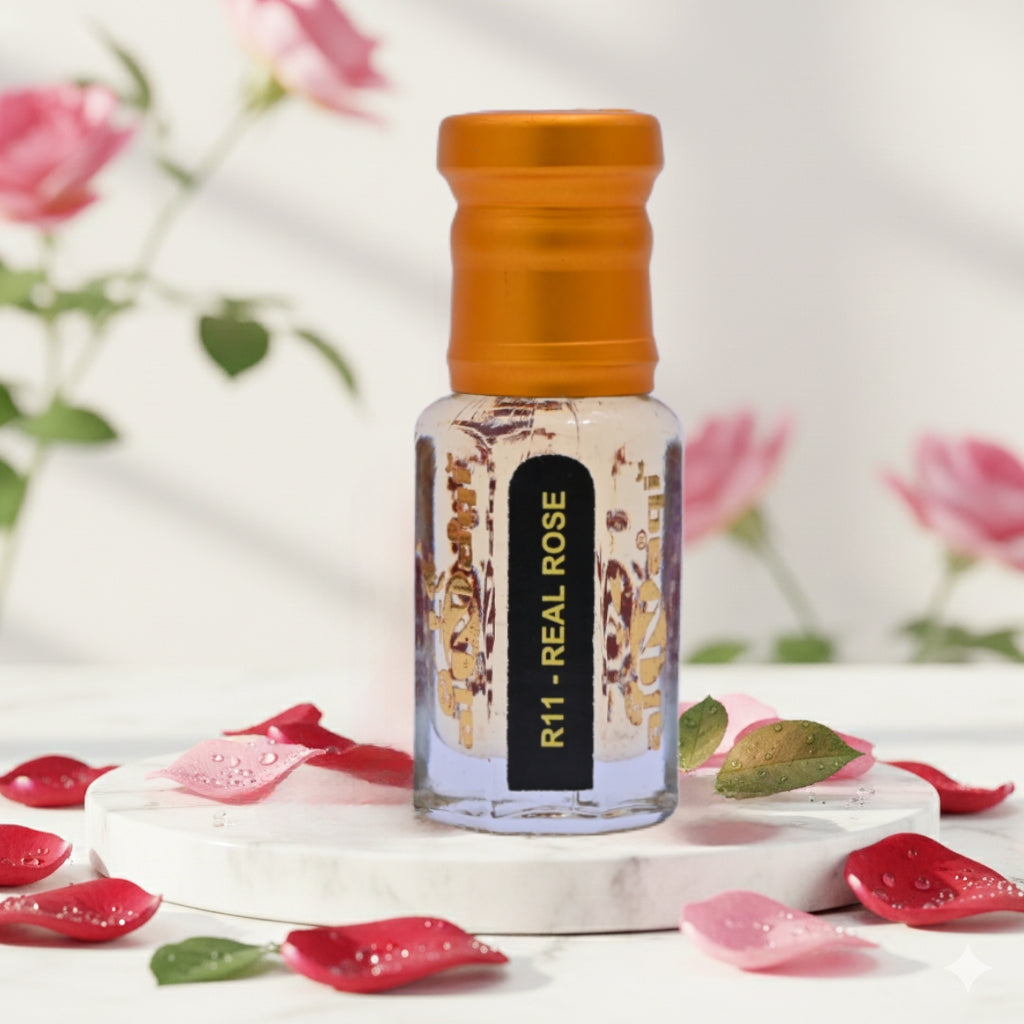 Perfume bottle labeled 'R11 Real Rose' with rose petals on a light background