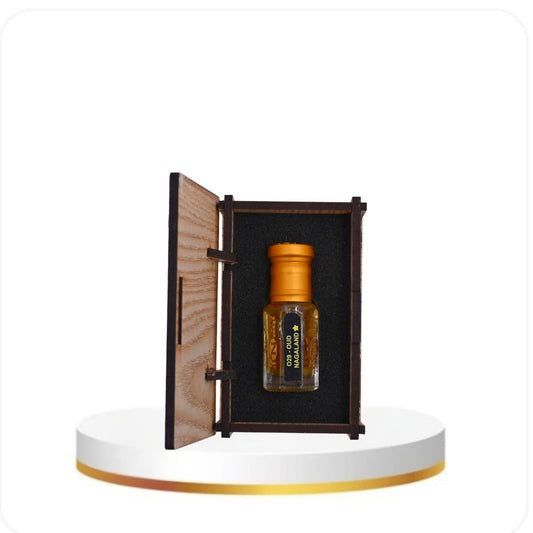 Small bottle with wooden cap in an open wooden box on a white platform