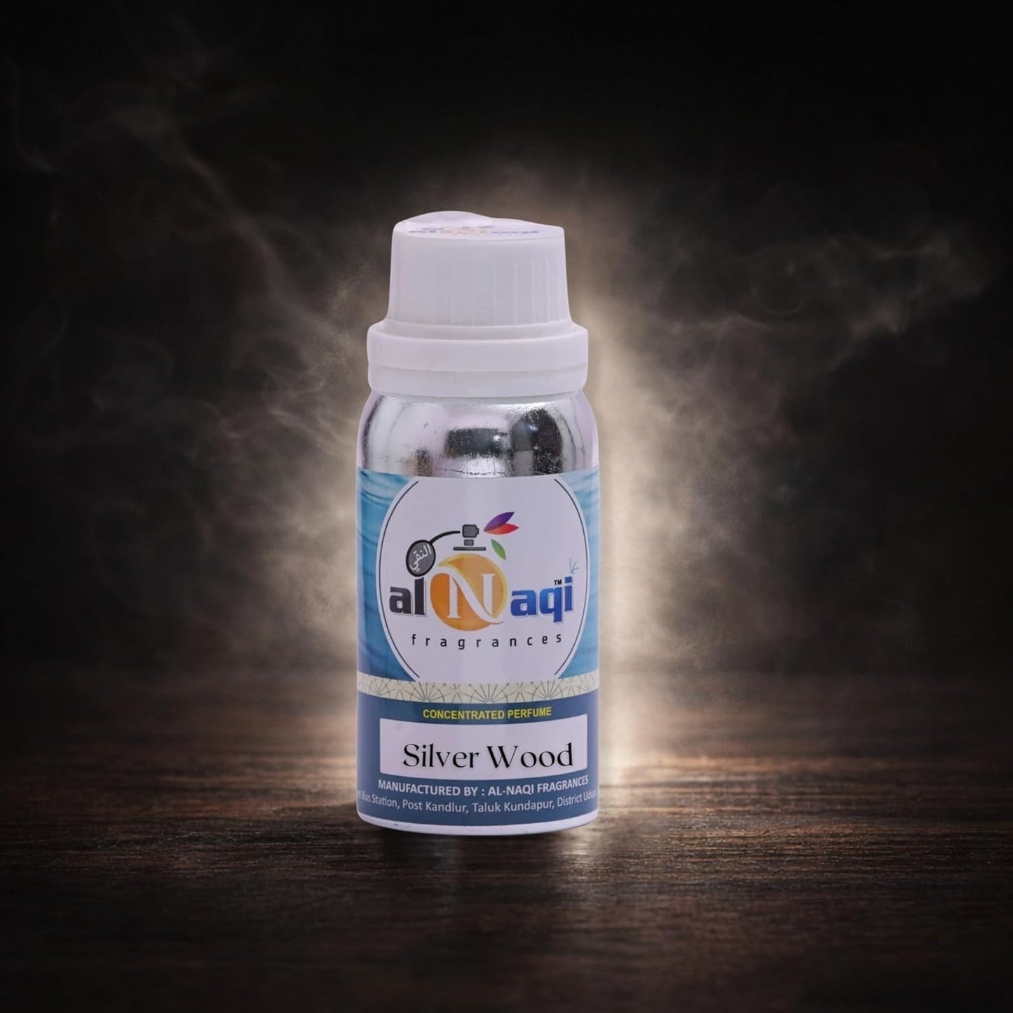 Bottle of Al Naji Silver Wood perfume on a dark background