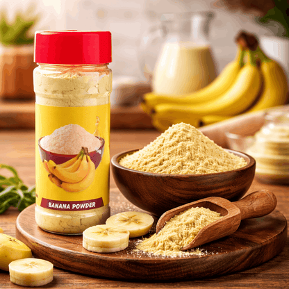 Banana powder container with a bowl of powder, bananas, and a wooden scoop on a wooden surface.