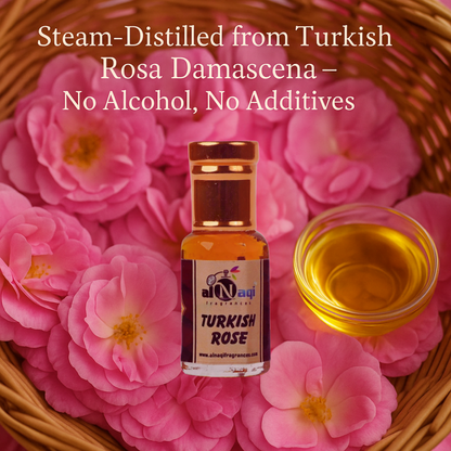 Turkish Rose oil bottle with flowers and oil in a glass on a wooden surface